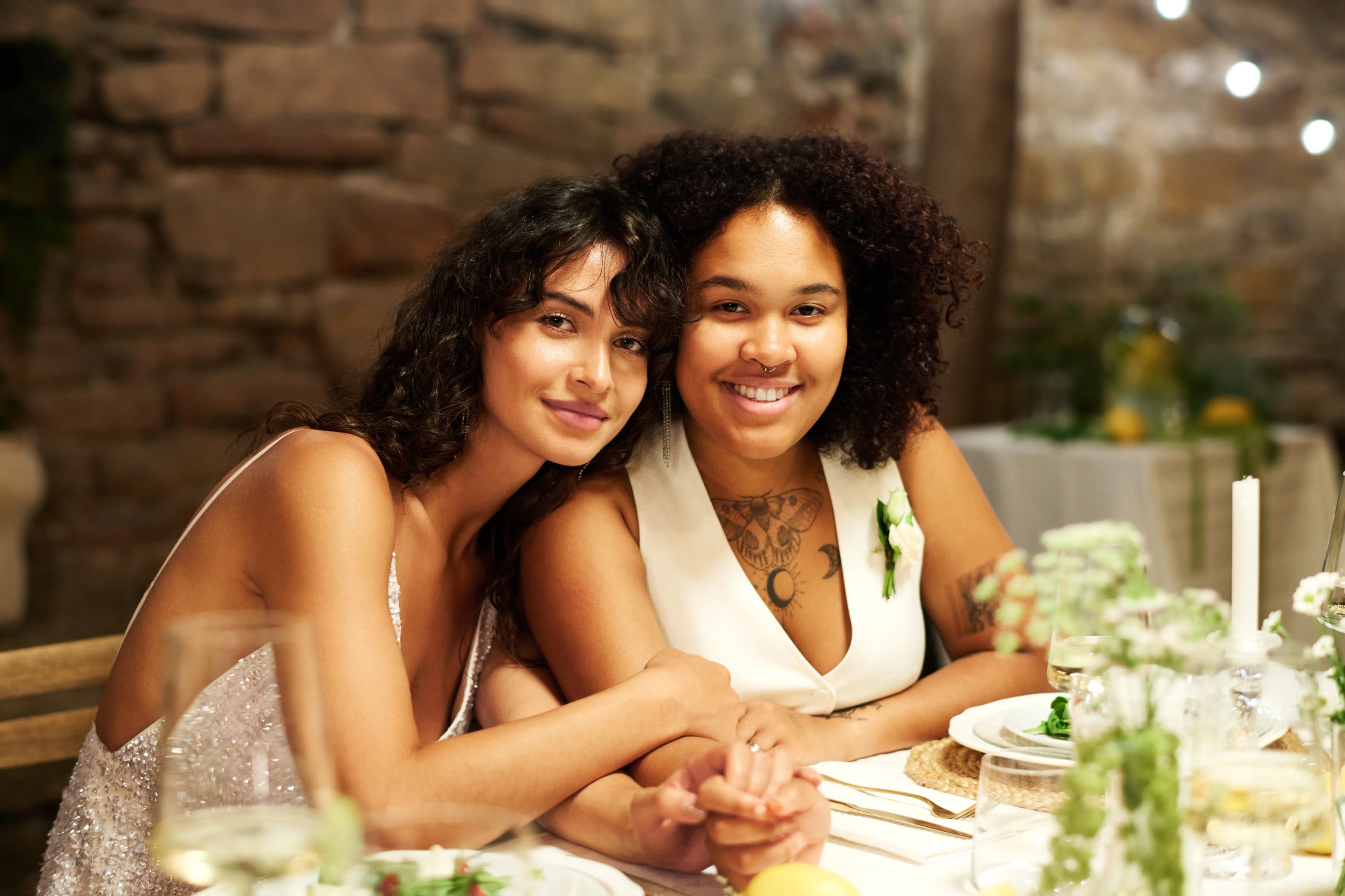 A trans couple sat having dinner at a restaurant